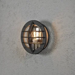 Konstsmide Utelamper - Veggskjold / Plafond<Oden vegglampe utendørs IP23 m/stikkontakt - Svart/klart glass